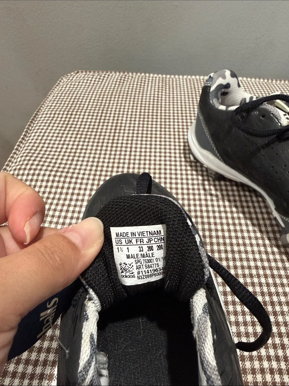 Black Adidas Sneakers cleats with White Stripes and Camo Lining
